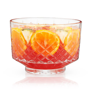 ELEGANT CUT CRYSTAL PUNCH BOWL - This cut crystal footed punch bowl features a unique shape and heavy set base with deep grooves. The elegant design elevates this punch bowl enough to serve as a gorgeous, functional centerpiece.
